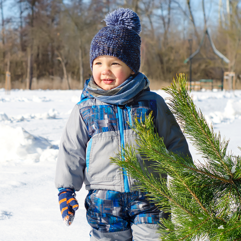 Toddler boy wearing Grey Blue Ski Set outdoors in snow