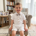 Baby boy wearing White Linen Shirt and Shorts Set with Floral Bow Tie